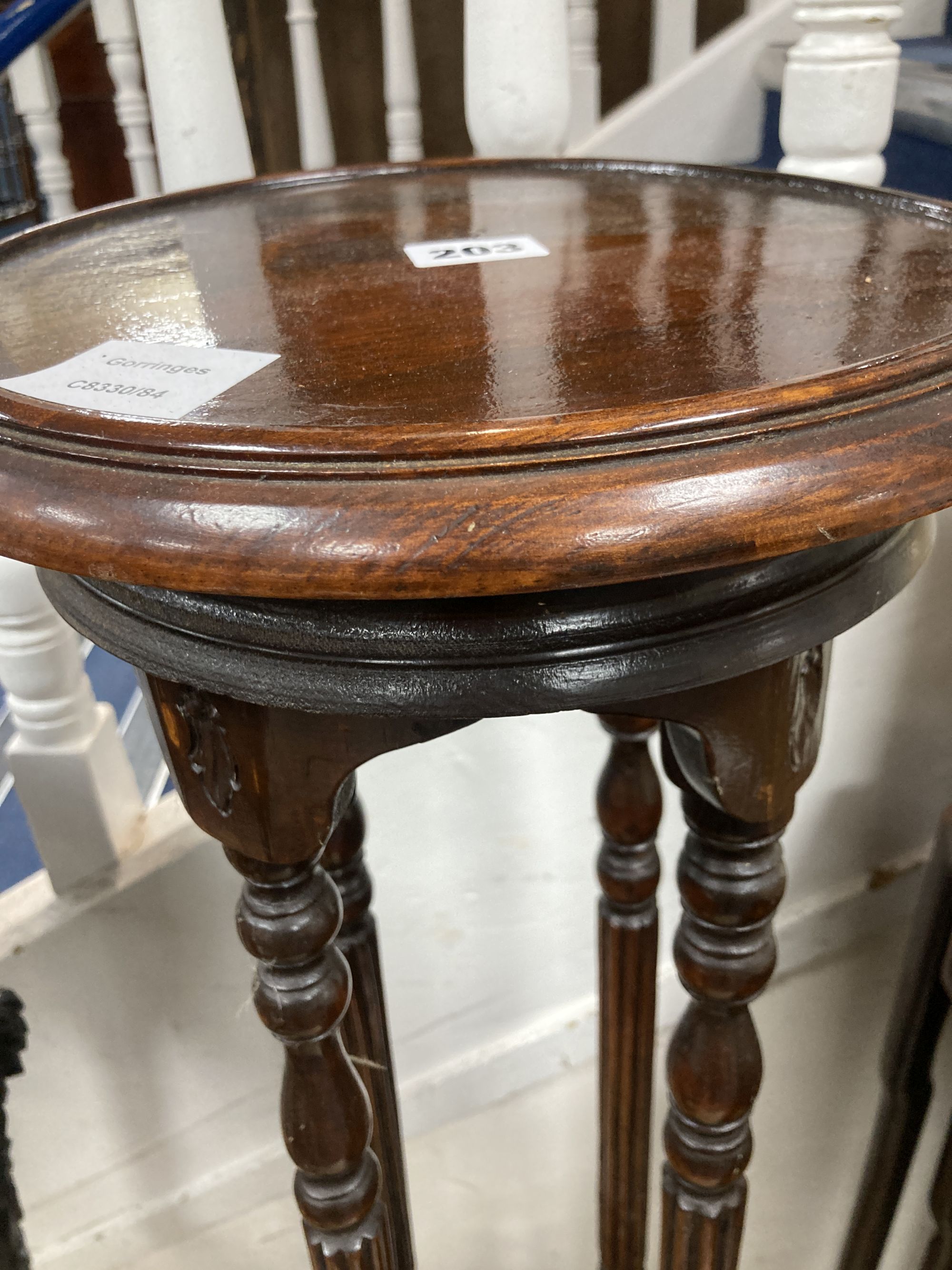 A mahogany two tier jardiniere stand, diameter 28cm height 100cm